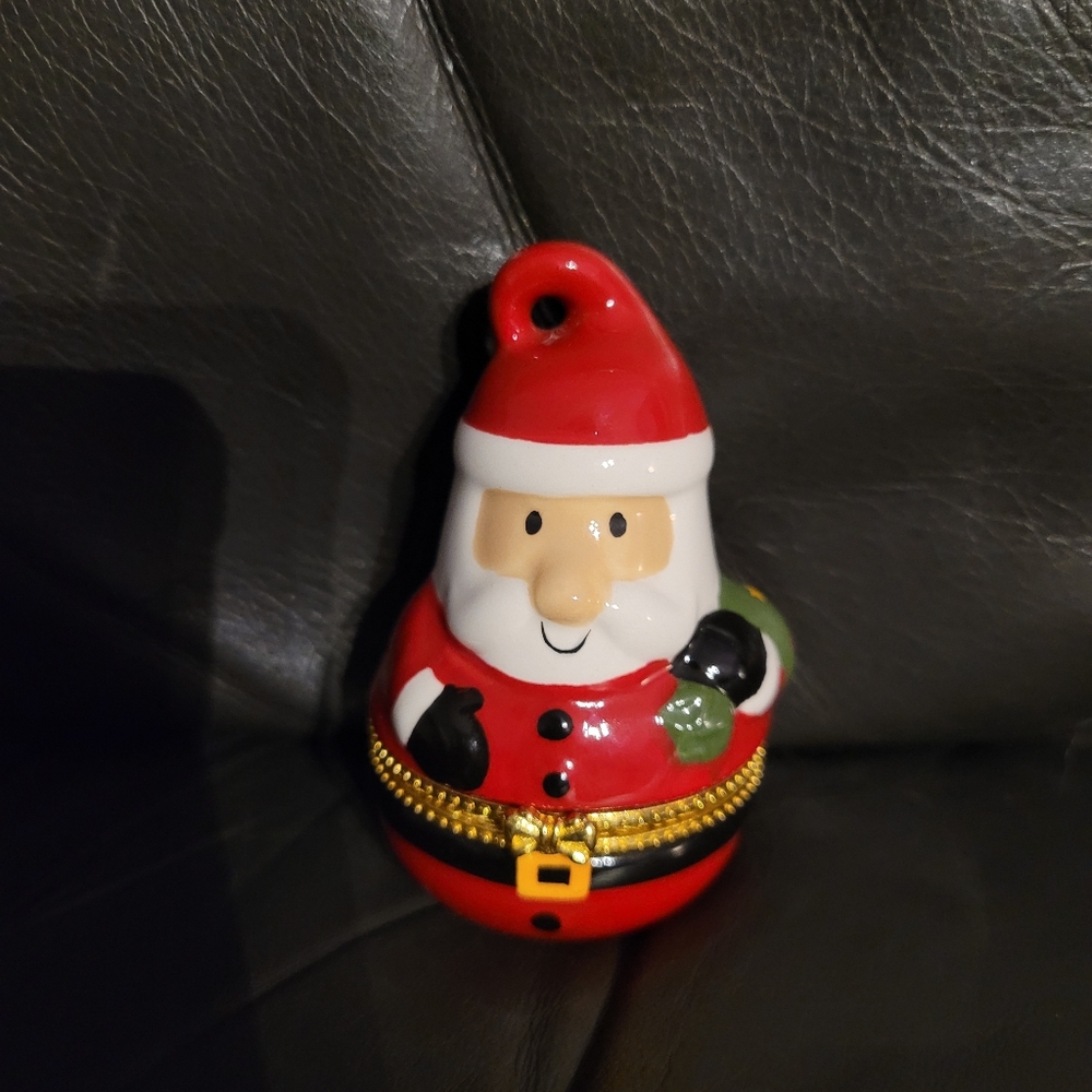 Avon- CZ pierced earrings in a collective Santa Claus Keepsake box.